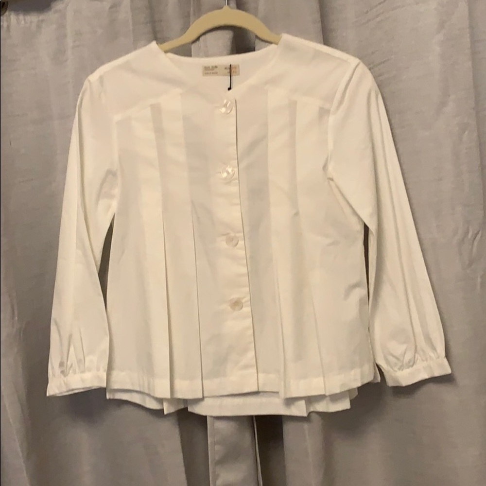 White pleated blouse